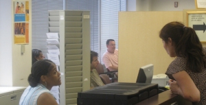 A DCRA employee assists a customer in the Business License Center.